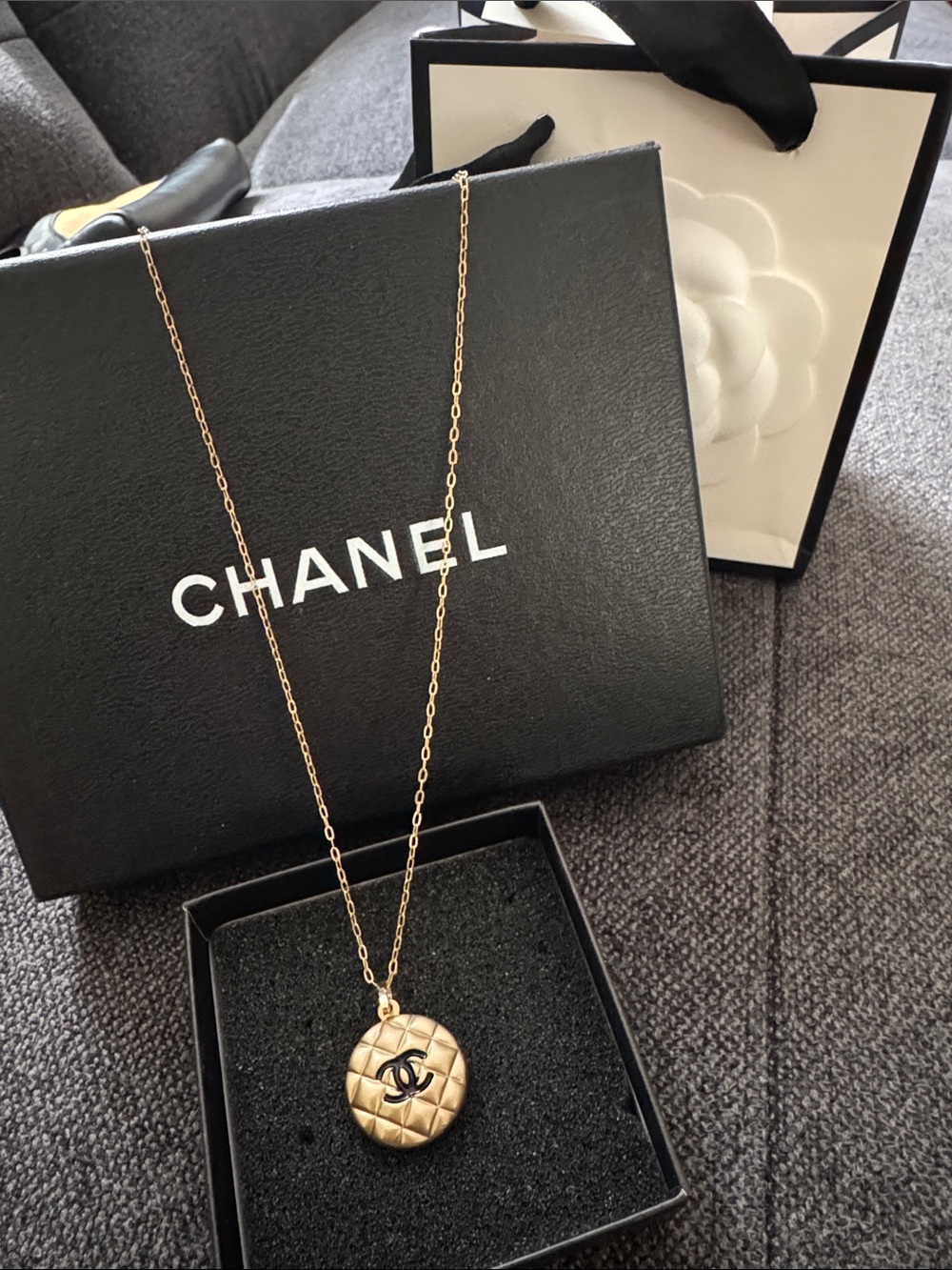 CHANEL Gold Quilted Medallion Necklace with Black Logo